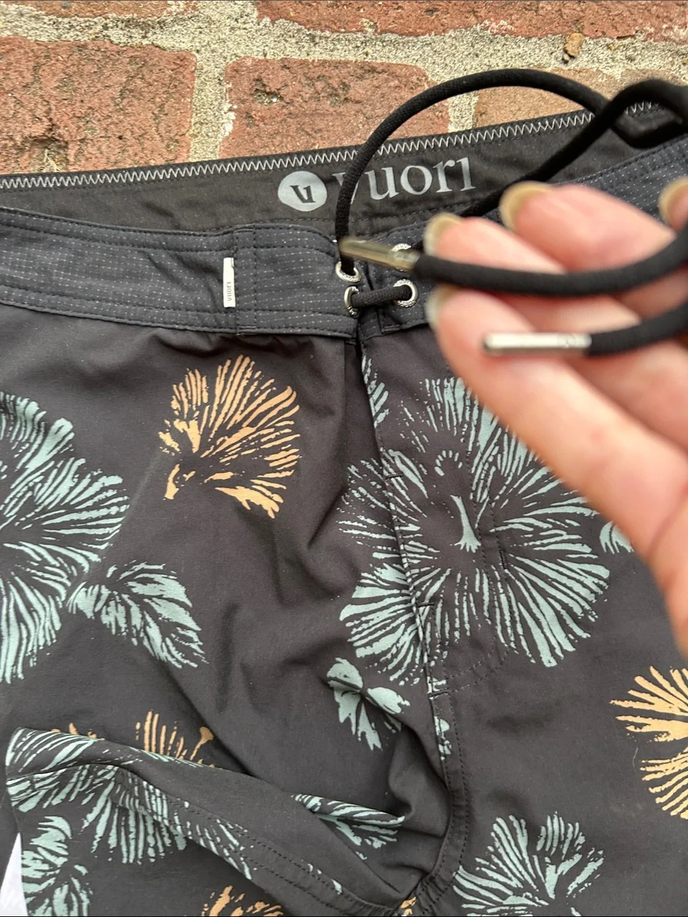 Vuori Black Swim Shorts with Teal & Tan Floral Print