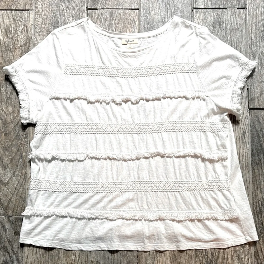 Style & Co white tee with stripes of fringe and crochet