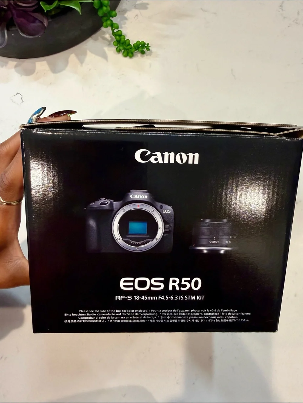Canon EOS R50 Black Mirrorless Camera with Red-Trim Strap and Green Case