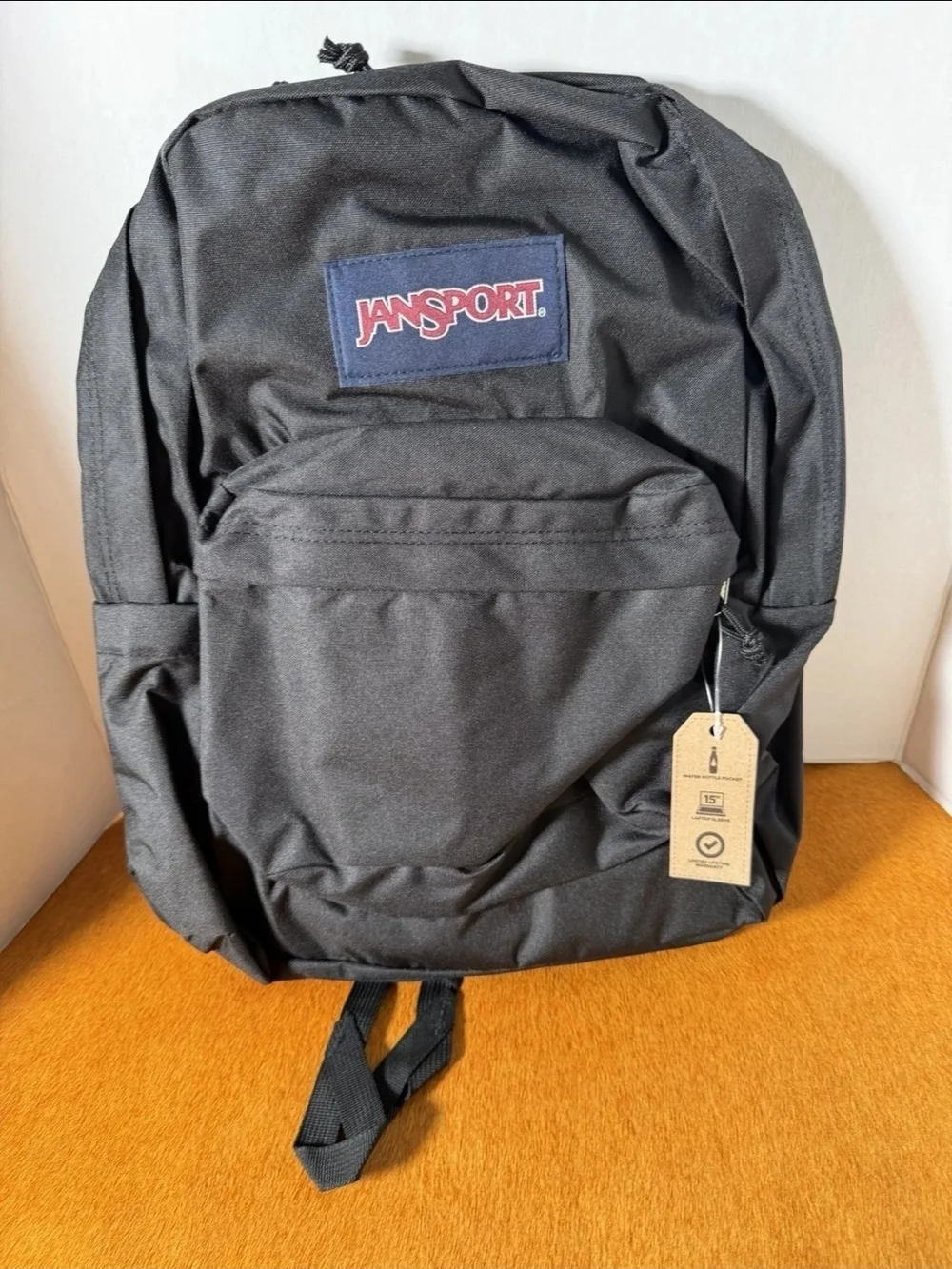 Jansport Black Backpack with Navy Patch and Red Logo