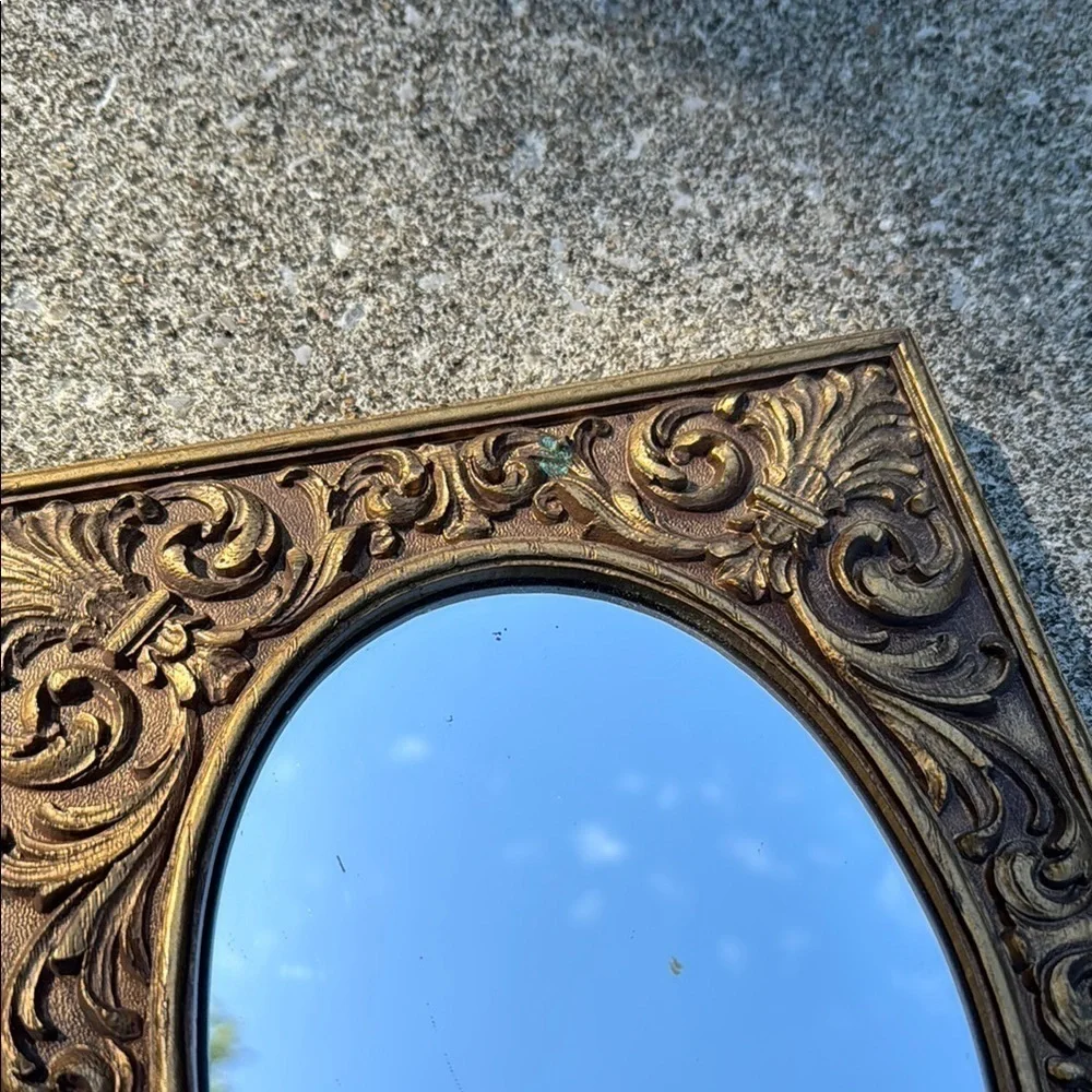 Gold Ornate Mirror with Intricate Scrollwork