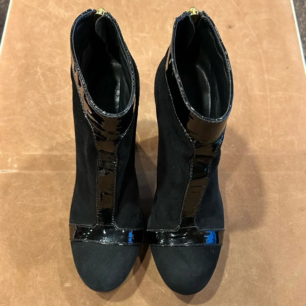 Tory Burch women’s black suede ankle boot with black leather and gold tr…