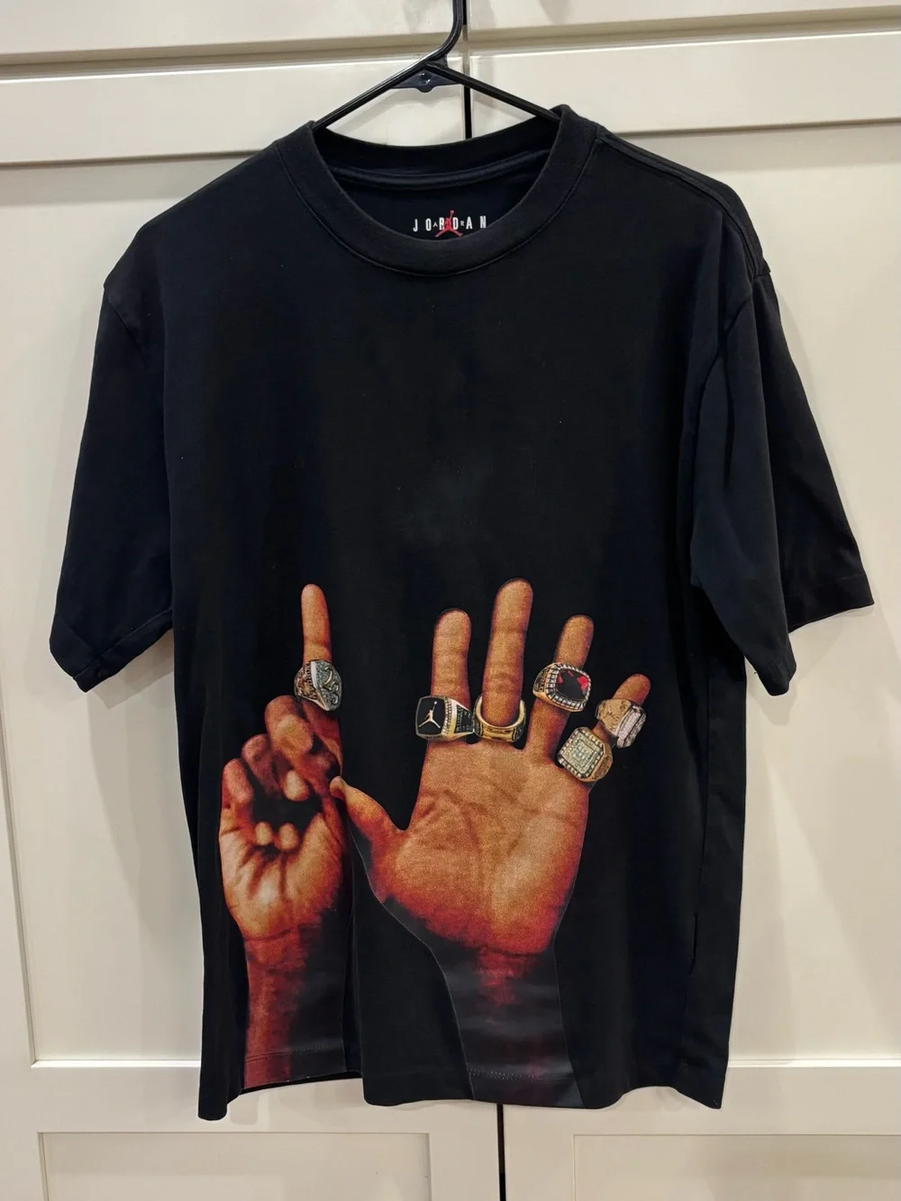 Jordan Black Short Sleeve Tee with Ringed Hands Graphic