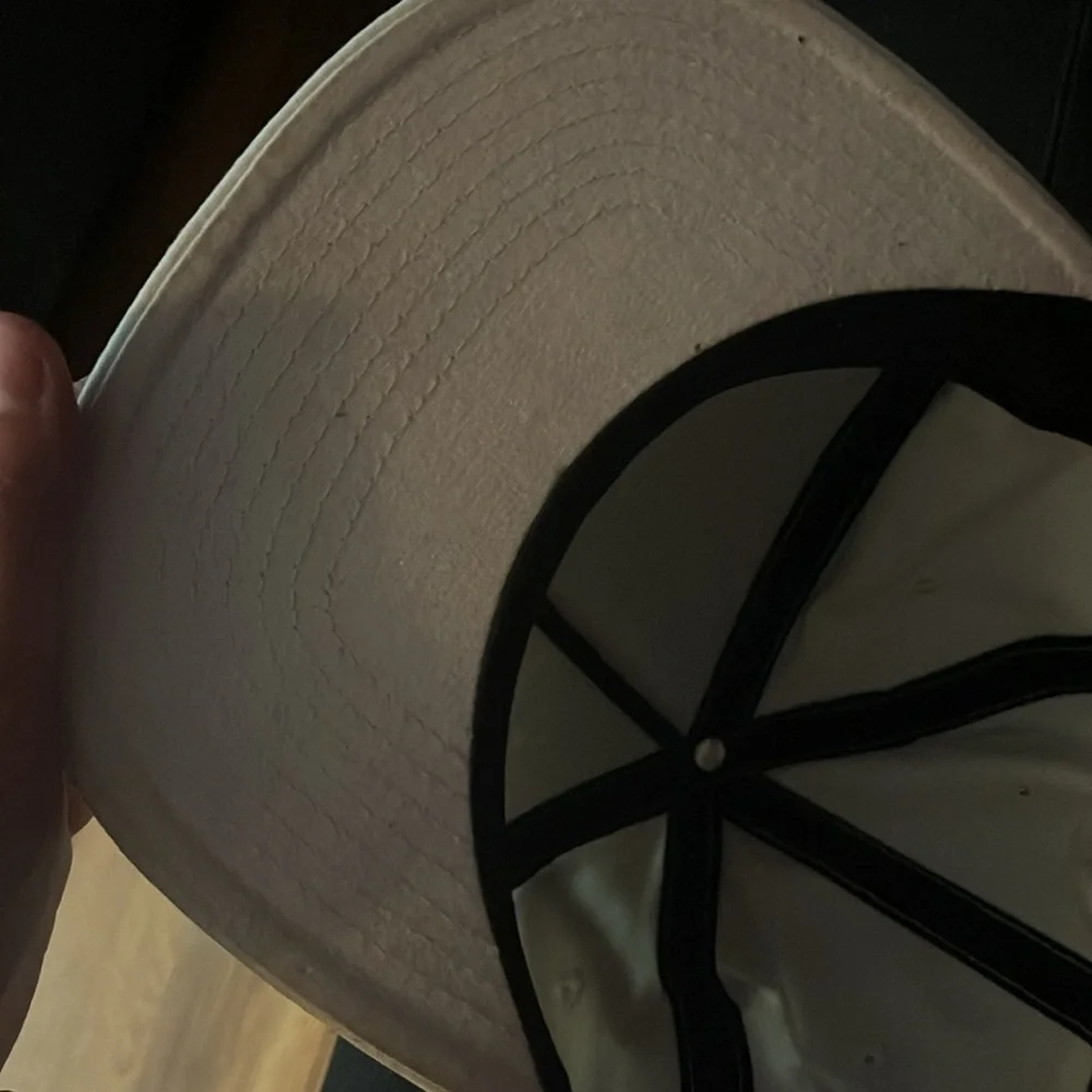 Kids off white colored DV shoes snap back hat some signs of wear see pics.