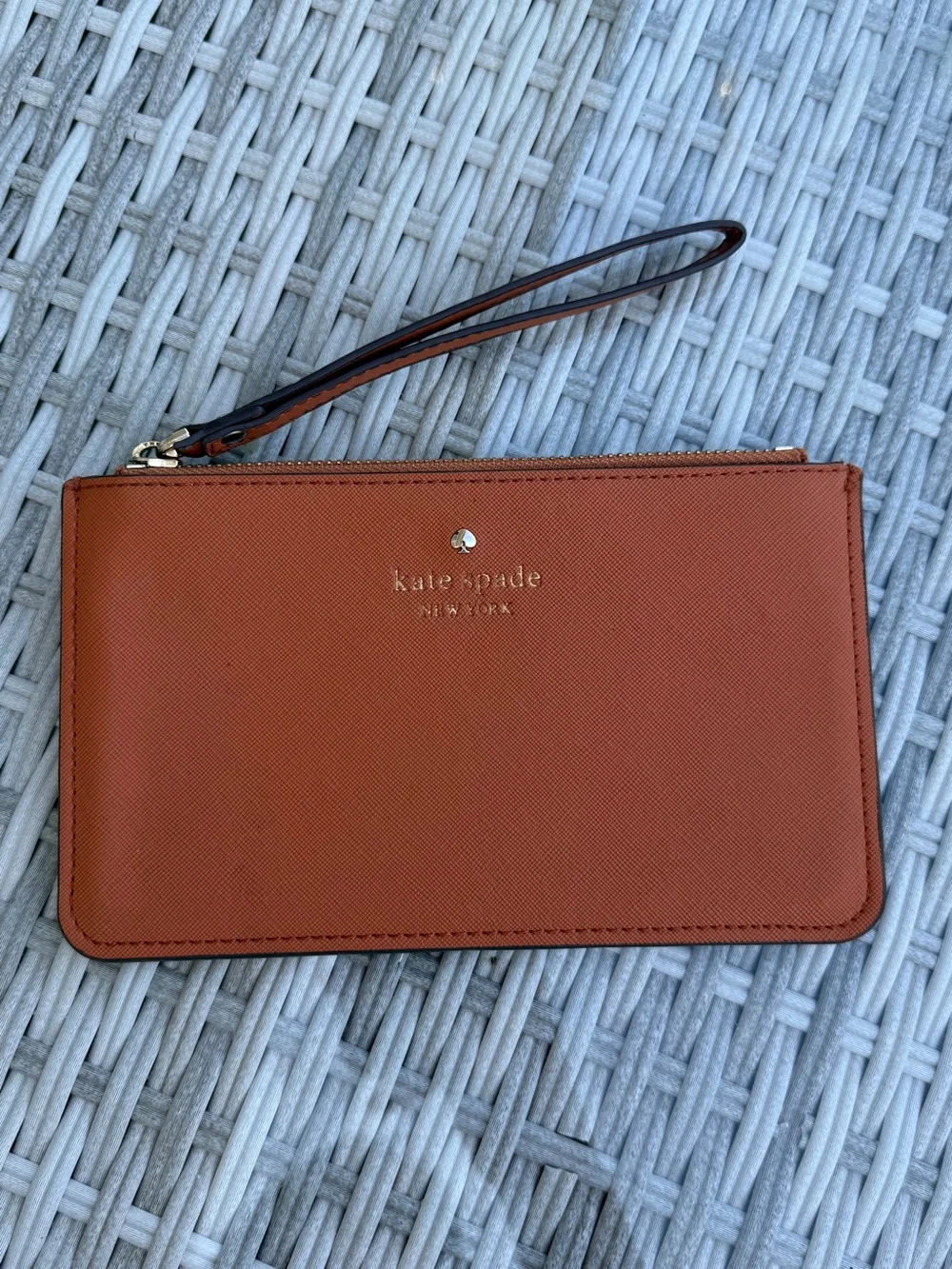 kate spade wristlet clutch in rust orange