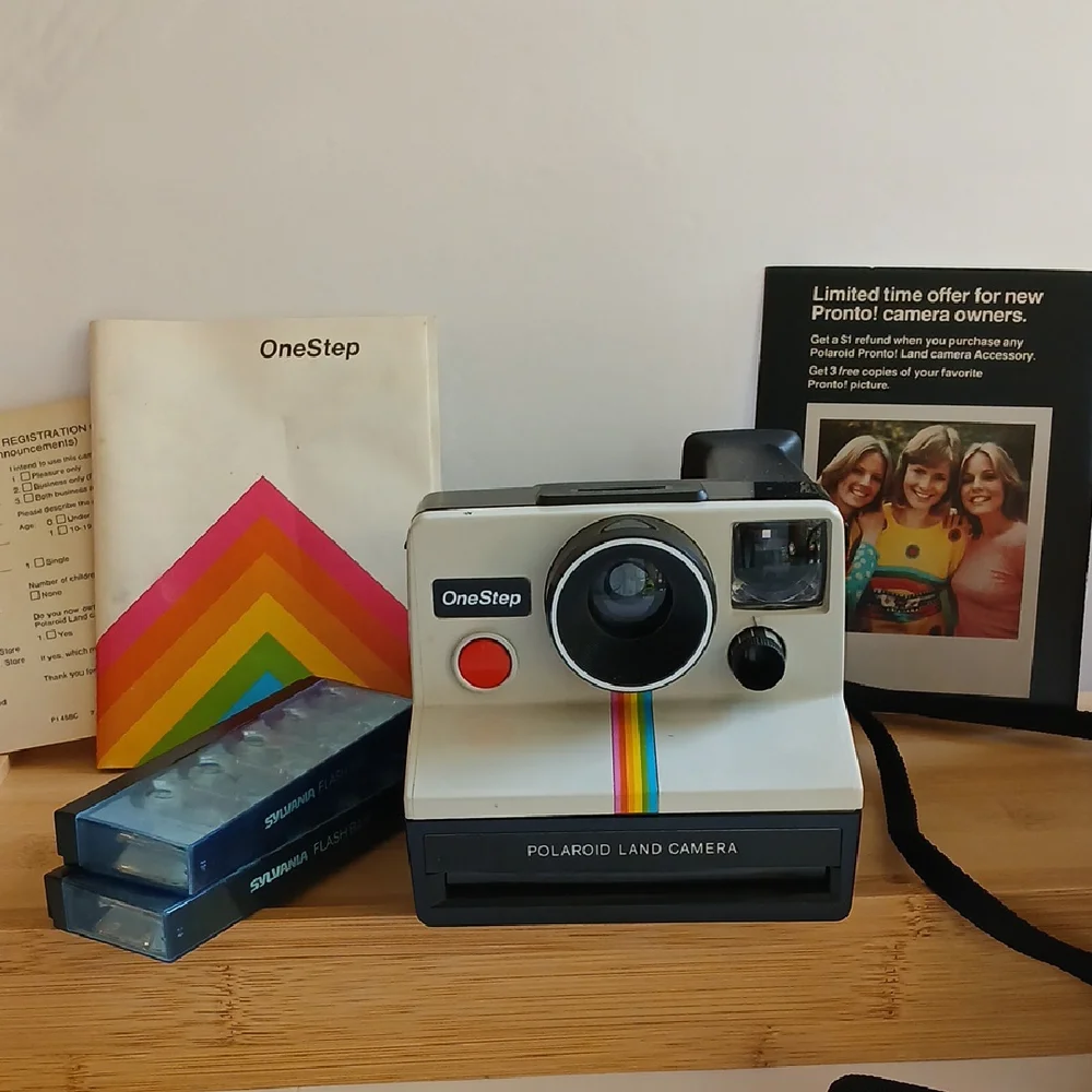 Vintage Polaroid Land One Step Instant Film Camera with Iconic Rainbow Design