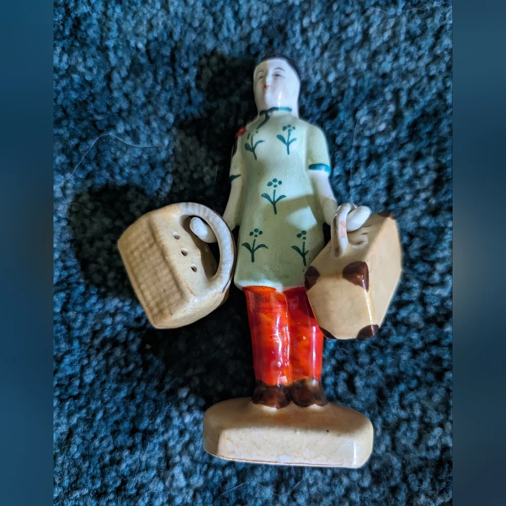 Vintage salt and pepper woman w luggage