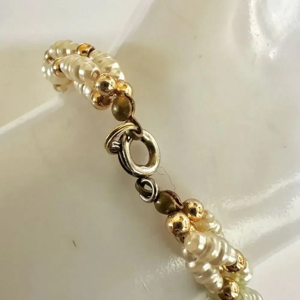 Faux pearl twisted multi strand bracelet faux pearl