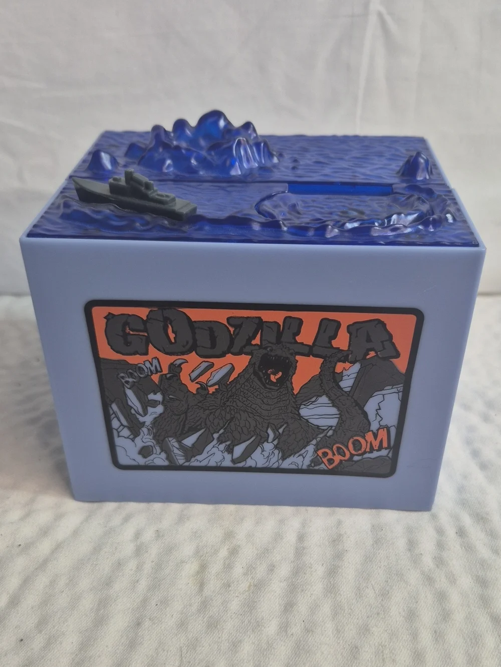 Godzilla Boom Collectible Still Bank Blue Plastic Piggy Bank with Ship Comic Art