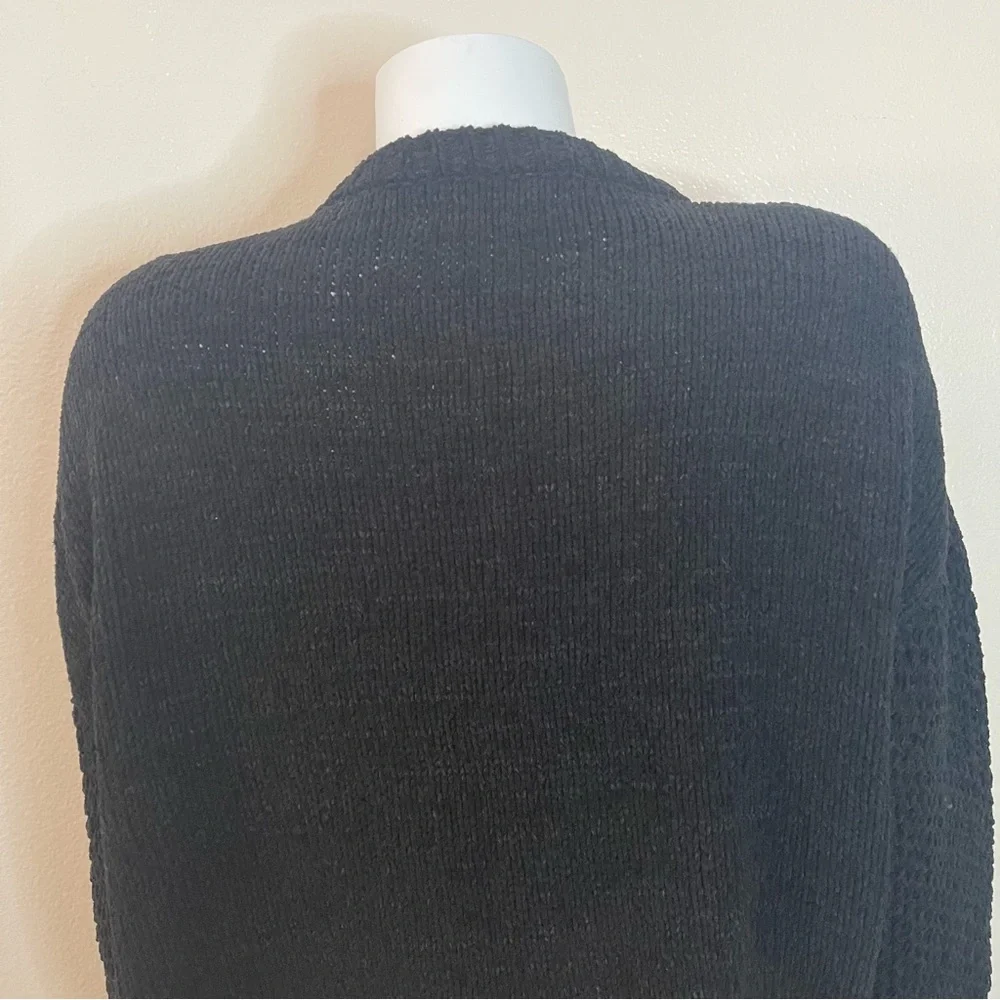 Black crew neck dropped shoulders ribbed trims knit sweater