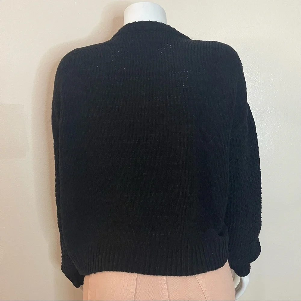Black crew neck dropped shoulders ribbed trims knit sweater